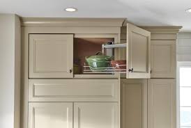 Deeper base cabinets make it difficult for you to reach the back of the counter or to plug in appliances. Yorktowne Cabinetry Wall Cabinet Swing Out Tray