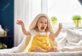 Cute baby in rabbit costume. Beautiful Smiling Cute Baby Girl On The Bed In The Room At Home Happy Child Laughing Stock Photo Picture And Royalty Free Image Image 88964934