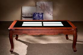 This rectangular piece has two square glass inserts on the top, set in an incised wooden frame. China Classic Design Solid Wood Glass Coffee Table China Furniture Modern Furniture