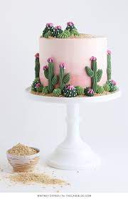 Learn how to create a buttercream cactus cake with an ombre buttercream sunrise, piped cactus, and edible sand. Cactus Cake The Cake Blog