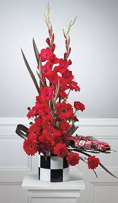 Red Car Arrangement Funeral Flowers By Lorraine Funeral Flowers Funeral Flower Arrangements Funeral Floral