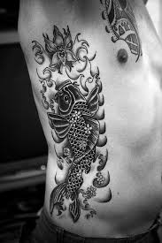 Black And White Koi Fish Tattoo Leg Looking Graceful This Koi Fish Inspires The Man To Be Strong And Hardy Just Like Itself Animal Tattoos For Men Rib Tattoo Rib Tattoos For Guys