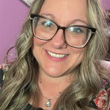 Teacher helps with flat tire in rain