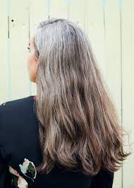 Going Gray Everything You Need To Embrace Your New Hair Color Gray Hair Growing Out Long Gray Hair Curly Hair Styles Naturally