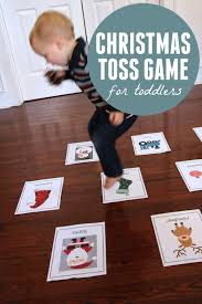 Activities, crafts, homeschool, schooling and advice. Christmas Toss Game For Toddlers Toddler Approved Preschool Christmas Games Christmas Games For Kids Preschool Christmas