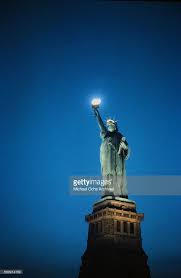 A Full Length View Of The Statue Of Liberty At Night As The Torch Is Statue Of Liberty Statue Liberty