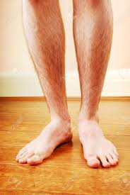 Hair loss on the legs can occur as a result of lifestyle factors or an underlying health condition. A Man S Legs Standing On Wooden Floor Stock Photo Picture And Royalty Free Image Image 5029834