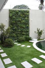 13 Imaginative Wall Garden Ideas For The Uninspired Yard Surfer Small Garden Landscape Design Small Garden Landscape Vertical Garden Diy