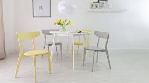 4 seater white round dining table and