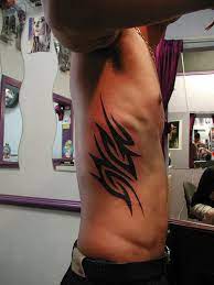 Tribal owl tattoo on rib. 17 Awesome Tribal Rib Tattoos Only Tribal