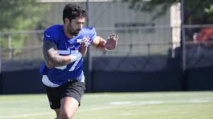 NFL player catching pythons