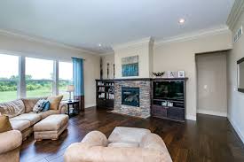 This Stunning Family Room Features 10 Foot Ceilings With White Crown Molding Espresso Floors A Natural Stone Firepl Family Room Natural Stone Fireplaces Room
