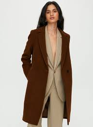 His clothes are very (suit) for working in a bank, but that is what he wears! Babaton Stedman Camel Coat Aritzia Ca