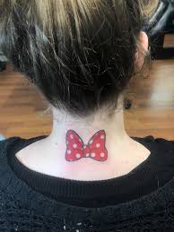 Pink bow tattoo on the chest. Minnie Mouse Bow Tattoo Bow Tattoo Disney Tattoos Minnie Mouse Bow