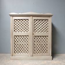 antique pine cupboard with lattice work