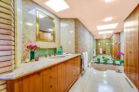 On the lower level of the home is a recreation room with a wine cellar, wet bar, second kitchen, pool table, and an exercise room. The Stunning House From The Marvelous Mrs Maisel Can Be Yours Home