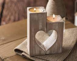 As an alternative to the first suggestion in this list, which uses birch logs standing vertically, you can cut them into longer pieces and drill tea light pockets into the sides of the bark, for a longer and shorter candle holder. Wood Candle Holders Valentines Day Gift For Her Wedding Gift Ideas Rustic Candle Holder Wooden Heart Shaped Decorative Tea Light Candles Home Decorations Handmade Table Centerpiece Decor Family Gift Amazon Co Uk Handmade