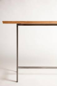 Narrow console table beautifully compliment other pieces of furniture and flowers, and when fitted with lights, they bring sophistication to rooms. Narrow Console Table In Solid Wood And Modern Steel Base For Sale At 1stdibs