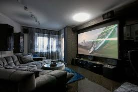 Projectors Vs Tvs Which Big Screen Should Rule Your Home Theater Living Room Theaters Home Theater Seating Small Home Theaters
