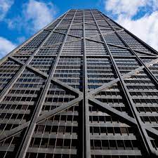 The john hancock building is the second largest building in chicago and the twelfth tallest building in the world, standing at 1, 127. John Hancock Center Ditches Its Famous Name Curbed Chicago