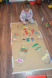 Giant Gingerbread Man Craft Happy Toddler Playtime Gingerbread Man Crafts Gingerbread Man Activities Holiday Party Activities