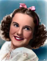 A 'POSED' CANDID FROM "CAN'T HELP SINGING" Leonid Kinskey, Deanna Durbin,  Robert Paige, and Akim Tamiroff are reviewing the script in the lobby of  the Escalante Hotel in Cedar City, Utah. Universal