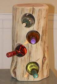 12 Creative Diy Projects With Tree Stumps For Your Home The Art In Life Rustic Wine Holder Tree Stump Furniture Tree House Decor