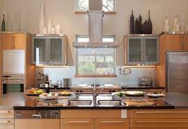 Even if your kitchen is dark, you can brighten it up by adding natural elements to the space above the cabinets. Decorating Above Kitchen Cabinets How To Use The Space Creatively