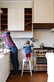 Remove your cabinet doors for an open shelving look without the extra work and cost. Farmhouse Kitchen Adding A Shelf Below Our Upper Cabinets Other Layouts We Considered The Grit And Polish