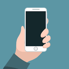 Female hand holding cell phone at the blur light background. Person Holding Cell Phone With His Hand Vector And Png Hand Holding Phone Computer Vector Photo Editing Techniques