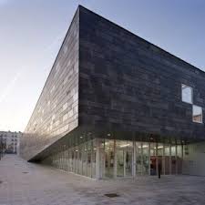 Parisian Suburb Gets Monolithic Tilting Sports Centre With Basalt Facade Architectuur Gevel Design