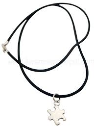 Why i no longer use the puzzle piece in my jewelry creations. Autism Puzzle Charm Rubber Necklace