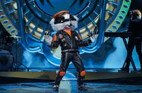 Please only refer to contestants by their masked persona. Who Is Badger On The Masked Singer Latest Theories About Their Identity Reality Tv Tellymix