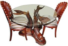 Cheap labor and cheap wood. Carved Teak Wood Koi Fish Base Dining Table And Shell Shaped Chairs From Indonesia