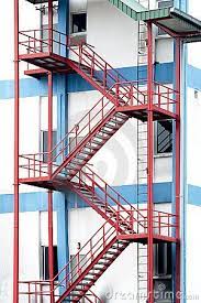 Wide angled photograph of an emergency ire exit staircase made of iron. Emergency Exit Stairs Steel Stairs Stairway Design Balcony Railing Design