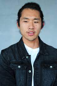 Asian Guy Black Denim Jacket Los Angeles Fashion Shoot Long Hair Tied Back Los Angeles Style Black Denim Jacket Fashion Shoot