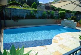 Edge luxury swimming pool with waterfall. Lap Of Luxury Pools Swimming Pool Builder Sydney