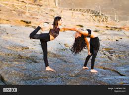 Yoga through meditation works remarkably to achieve this harmony and helps the mind work in sync with the body. Two Girls On Beach Image Photo Free Trial Bigstock