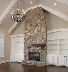 The Perfect Living Room Vaulted Ceilings And An Iron Chandelier Floor To Ceiling Stone Vaulted Ceiling Living Room Farm House Living Room Fireplace Built Ins