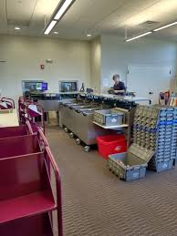 Automated Materials Handling Sorter In The Circulation Workroom Reading Ma Pl They Say The Noise Is Minimal Material Handling Minimalism Self Service