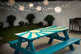 Diy Sunburst Painted Picnic Table The Home Depot Blog Wooden Picnic Tables Painted Picnic Tables Picnic Table