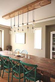 The right chandelier can make a dramatic difference. First Time Fancy Dining Room Diy Dining Table Light Fixture Rustic Dining Room Lighting Diy Dining Table Dining Room Light Fixtures
