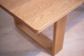 Handcrafted farmhouse dining table and bench with rustic reclaimed wood top and farrow and ball painted base. The Olson American White Oak Dining Table Retrograde Furniture Custom Timber Furniture