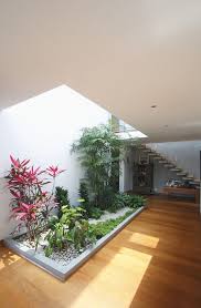 You could have a diy shelf full of potted plants or have the floor covered with beautiful plants at corners or lined up against the walls. 20 Indoor Garden Designs That Will Bring Life Into The Home Home Design Lover Courtyard Design Interior Garden Inside Garden