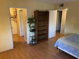 View of a modern bathroom with toilet and way to the bedroom. Large Private Masterbedroom Walk In Closet Bath Spareroom