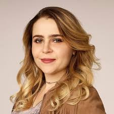 Post a picture of the actress who voices so many voices, including Nat  Kin-kle