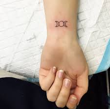 A tattoo that wraps around like a bracelet. 50 Amazing Wrist Tattoos For Men Women Tattooblend