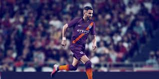 The orange sash is overlayed nicely against a dark purple base to create a striking look that is as easy on the eye. Manchester City Fc S 2018 19 Third Kit Reintroduces The Sash Nike News