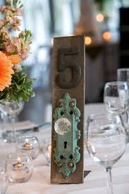Fun Friday Is Full Of Unique And Fun Table Number Ideas Dreamweddingbox The Wedding Notebook Unique Table Numbers Wedding Table Numbers Wedding Doors