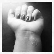 Attractive anchor tattoo on wrist. Black And White Ink Girl Show Nice Anchor Tattoo On Wrist